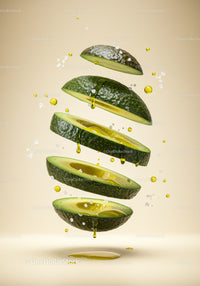 Floating sliced avocado with dripping olive oil and salt