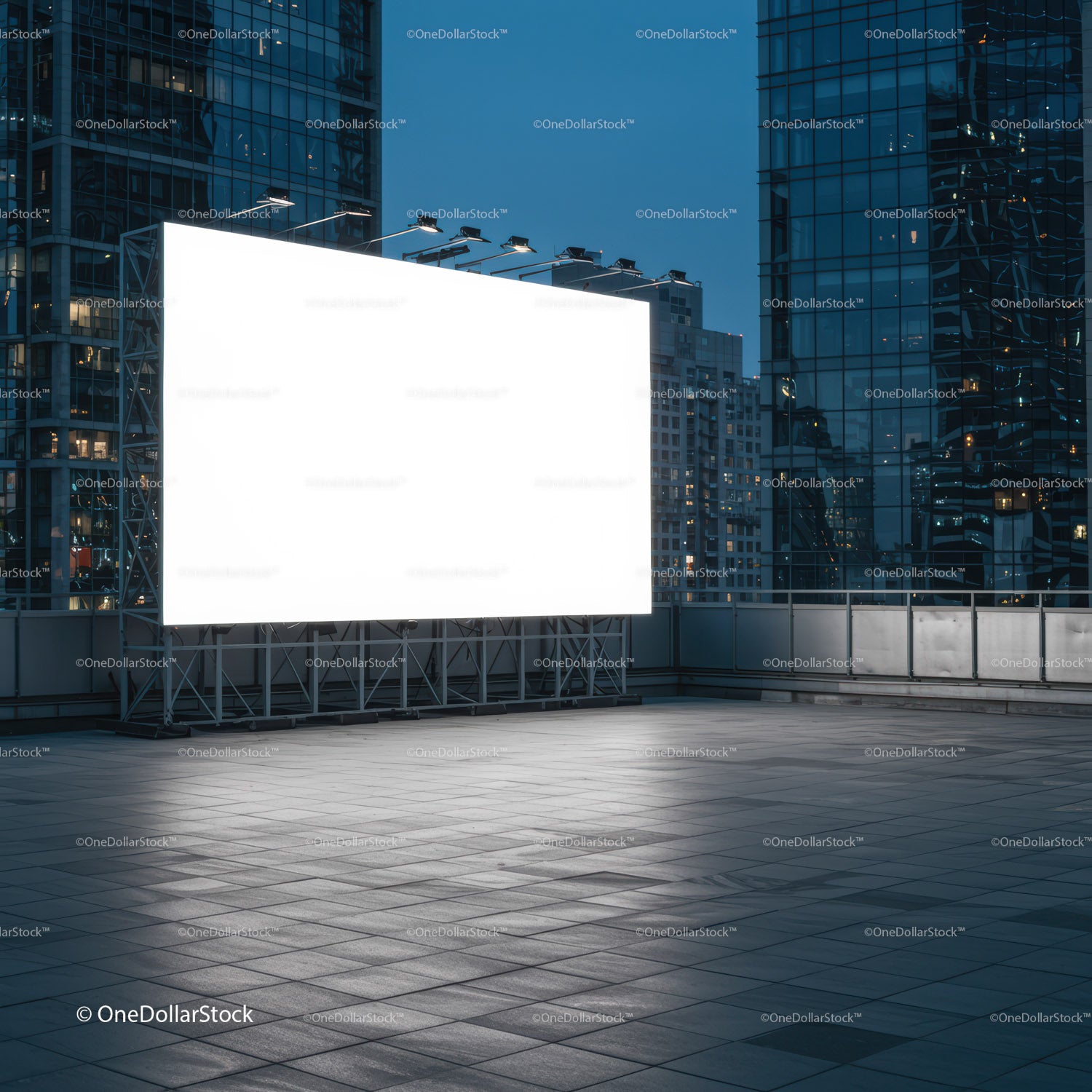 Large illuminated billboard on modern city rooftop at dusk