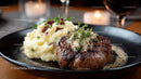 Juicy Steak with Mashed Potatoes and Herb Garnish in Elegant Restaurant