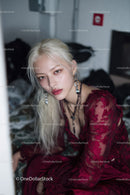 Stylish Young Woman in Red Lace Dress with Modern Jewelry