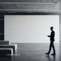 Businessman walking past empty modern gallery wall