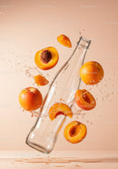 Fresh apricots splashing around glass bottle on peach background