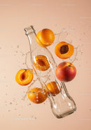 Fresh Apricots Splashing Around Glass Bottle