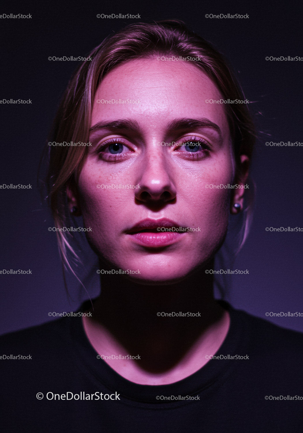 Close-up portrait of contemplative woman with dramatic light