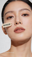 Close-up of serene woman with bestseller tag on cheek