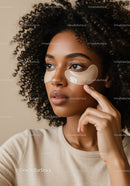 Woman with Under-Eye Patches Performing Facial Skincare in a Spa Environment