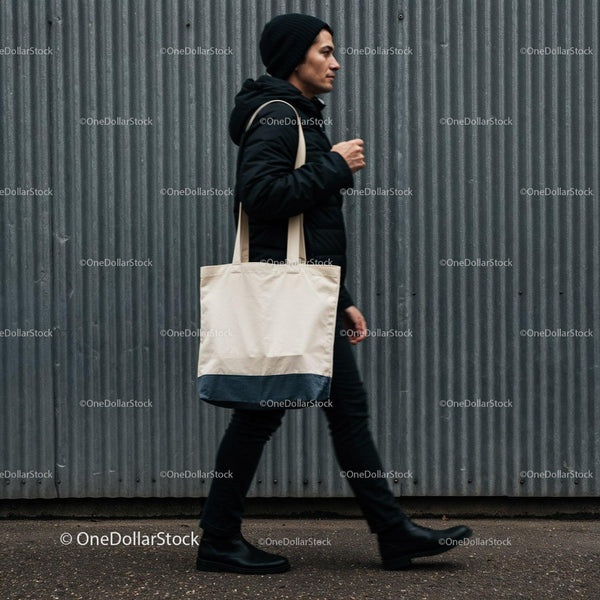 Man walking with tote bag in urban street setting JPG Mockup Image