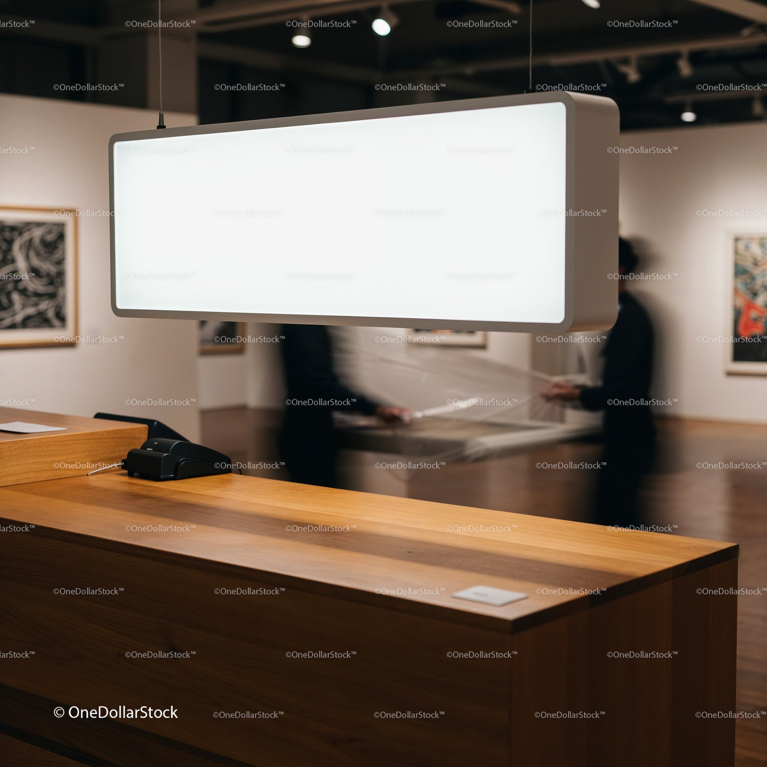 Minimalist gallery reception with modern lighting fixture