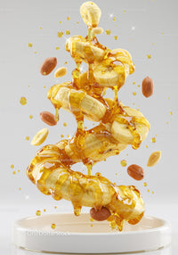 Banana slices and peanuts drizzled with golden honey