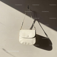 Minimalist White Leather Handbag Hanging on Wall JPG Mockup Image preview