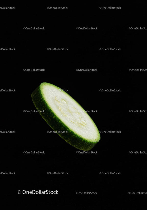 Fresh cucumber slice isolated on black background