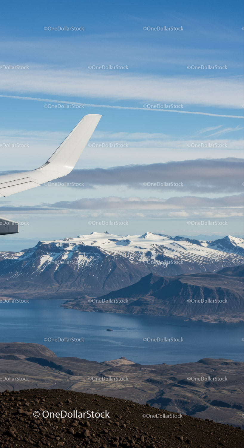 Scenic aerial view of snow-capped mountains and volcanic terrain
