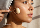 Close-up of Woman Using Facial Roller for Skin Rejuvenation