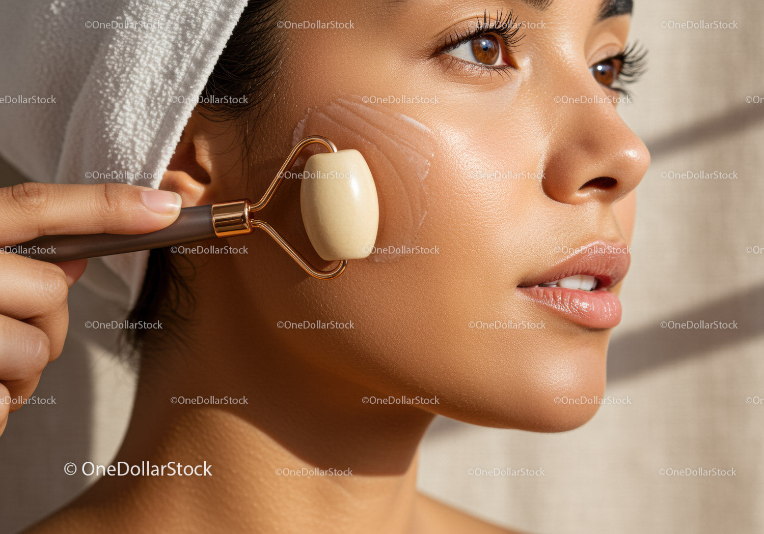 Close-up of Woman Using Facial Roller for Skin Rejuvenation