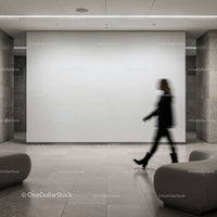 Blurred silhouette walking through modern gallery space