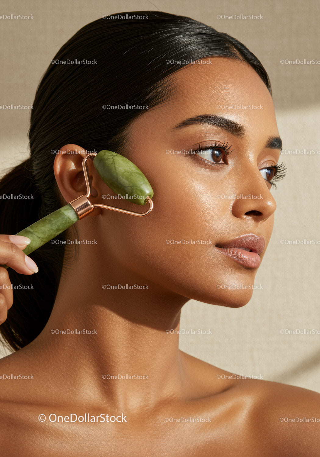 Close Up of Woman Using Jade Roller for Facial Massage