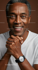 Portrait of Smiling Mature Man with Black Watch against Warm Background