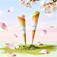 Two Waffle Cones with Pastel Ice Cream and Cherry Blossoms