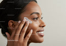 Beautiful Woman Applying Face Cream in Skincare Routine