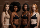 Diverse women in elegant lingerie stand confidently together