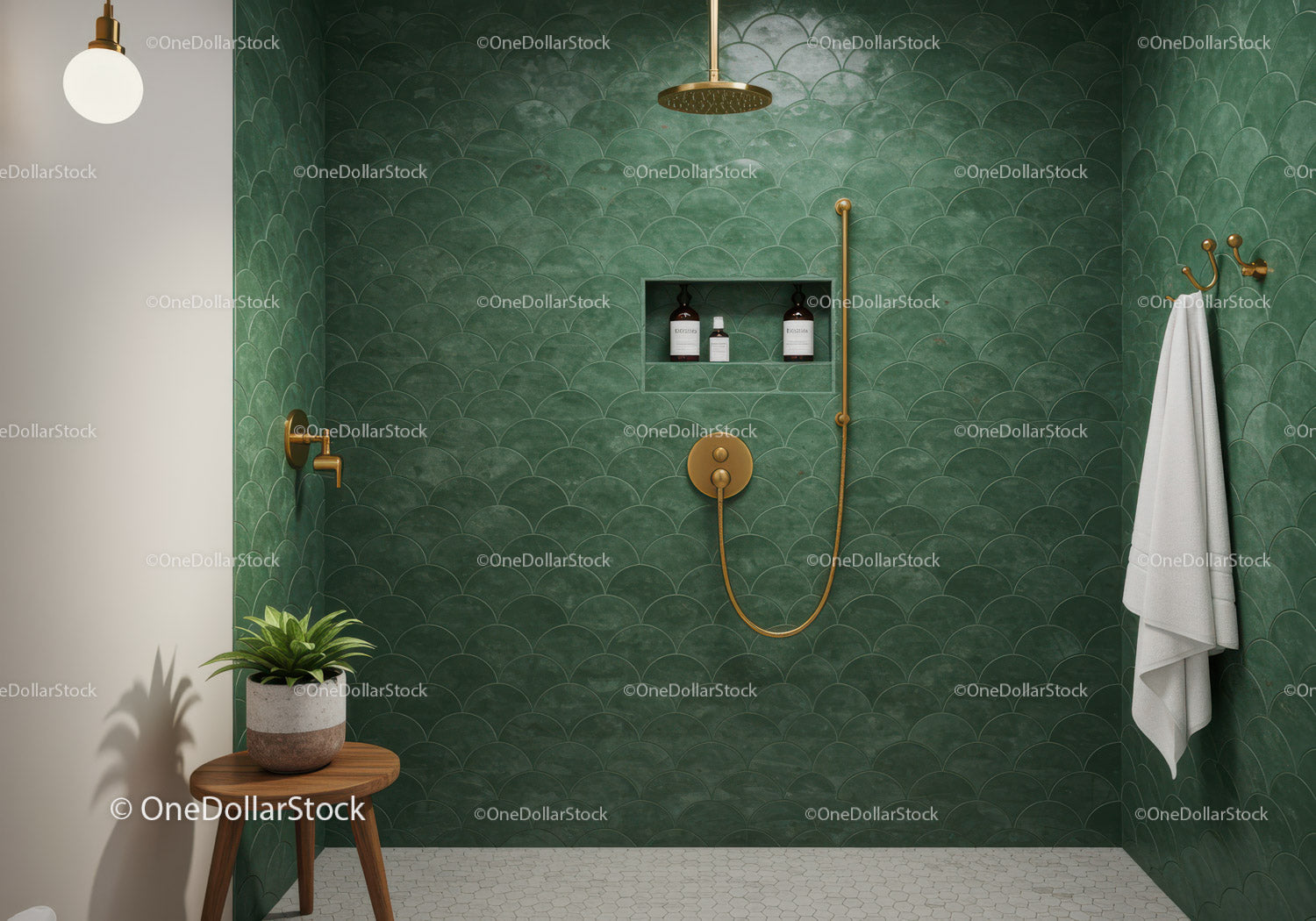 Modern green tiled shower with gold fixtures and plant