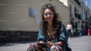 Young Woman Smiling in Casual Urban Outfit on City Street