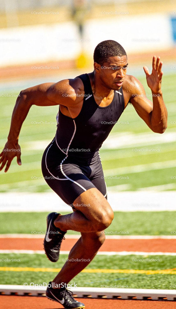 Athlete sprinting powerfully on outdoor track