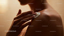 Woman applying moisturizing cream on shoulder closeup
