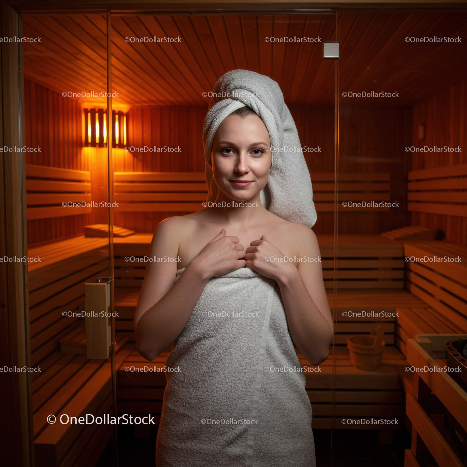 Young Woman in Sauna with Towel Relaxing in Wellness Center