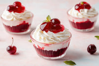 Cherry Parfait with Whipped Cream and Red Cherries in Glass