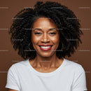 Happy Woman with Curly Hair and Bright Smile Against Brown Background