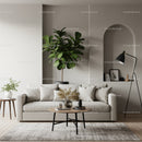 Cozy minimalist living room with soft beige sofa and plants