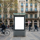 Blank urban billboard on busy street with cyclists