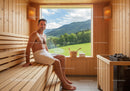 Man Relaxing in Wooden Sauna with Scenic Mountain View