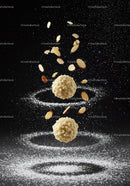 Almond Truffles Suspended with Sliced Nuts and Powder