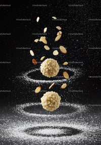Almond Truffles Suspended with Sliced Nuts and Powder