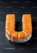 Fresh salmon sushi rolls arranged in a U shape