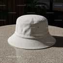 Minimalist beige bucket hat on textured round table