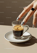 Hand with Stylish Nails Reaching for Espresso Shot