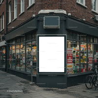 Blank illuminated billboard on urban street corner
