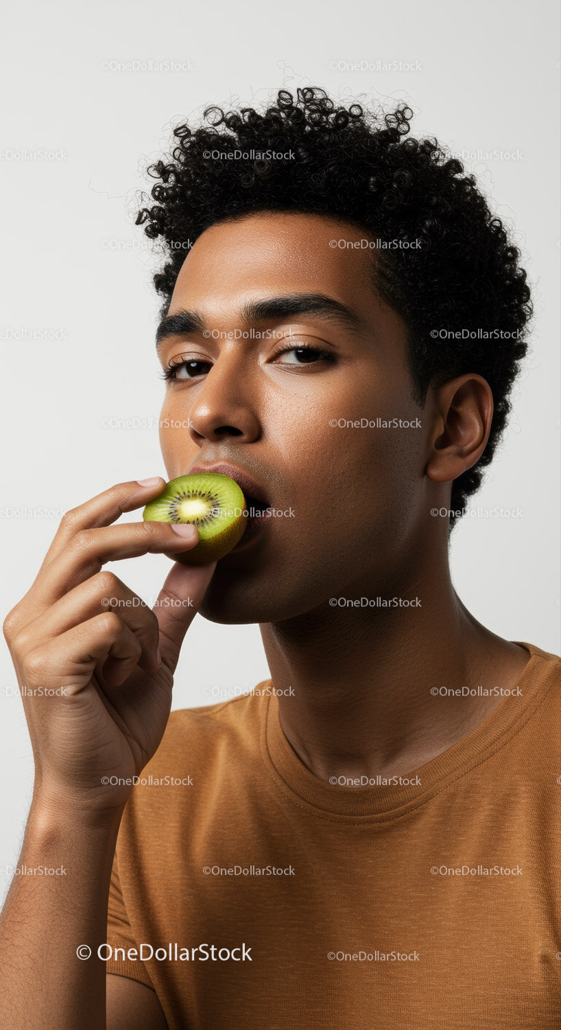 Young Man Eating Sliced Kiwi Fruit with Healthy Lifestyle Vibe