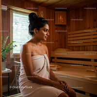 Young Woman Relaxing in Spa Sauna with Wooden Interior