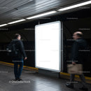 Commuters Passing by Illuminated Advertising Board