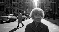 Elegant Senior Woman Walking in City Street with Vintage Cars