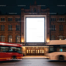 Historic Brick Building with Illuminated Blank Billboard at Night