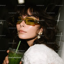 Fashionable Woman with Sunglasses and Green Iced Drink