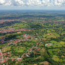 Colorful Rural Landscape with Green Fields and Small Town Houses