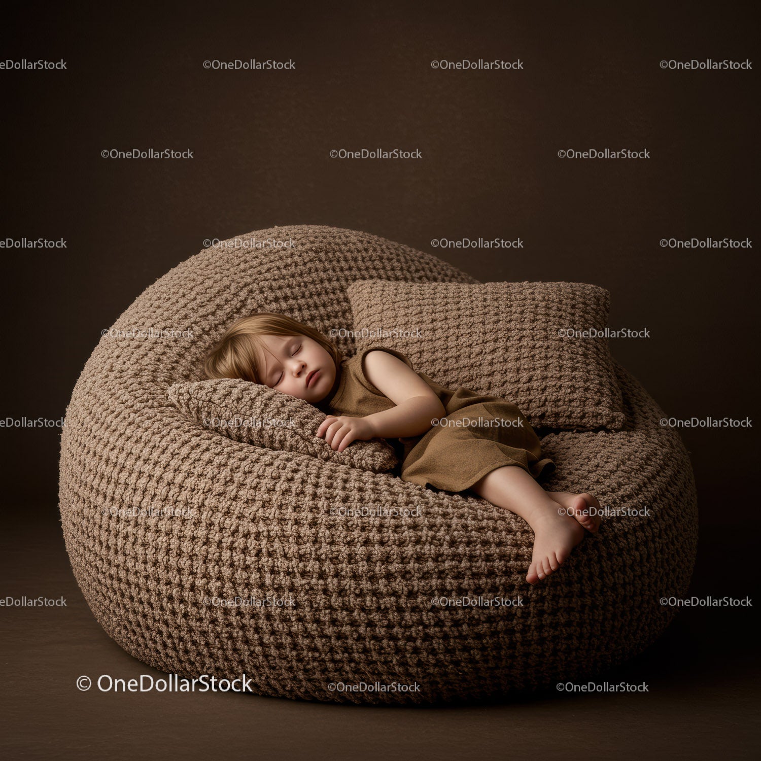 Sleeping toddler resting on cozy knit bean bag chair