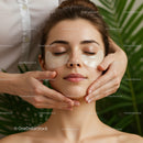 Relaxing Facial Massage with Sheet Masks on Young Woman in Spa Setting