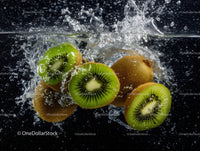 Fresh Kiwi Slices Splashing into Water with Water Droplets